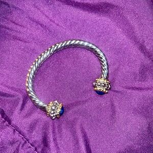 Silver tone bracelet with blue stones